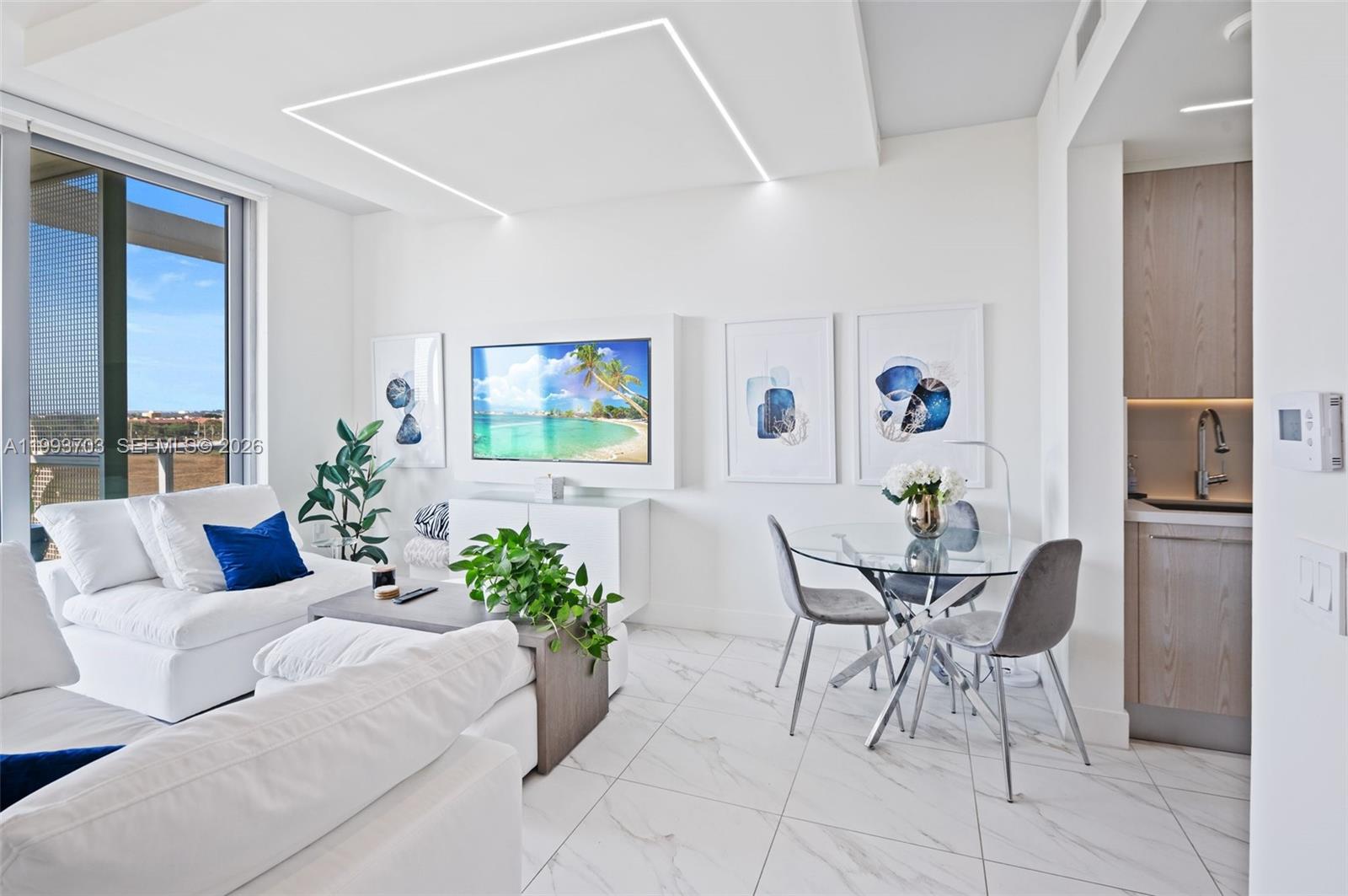 2000 Metropica Way, Unit 508 Sunrise, FL 33323 - Photo 5 of 25 a living room with furniture and a potted plant