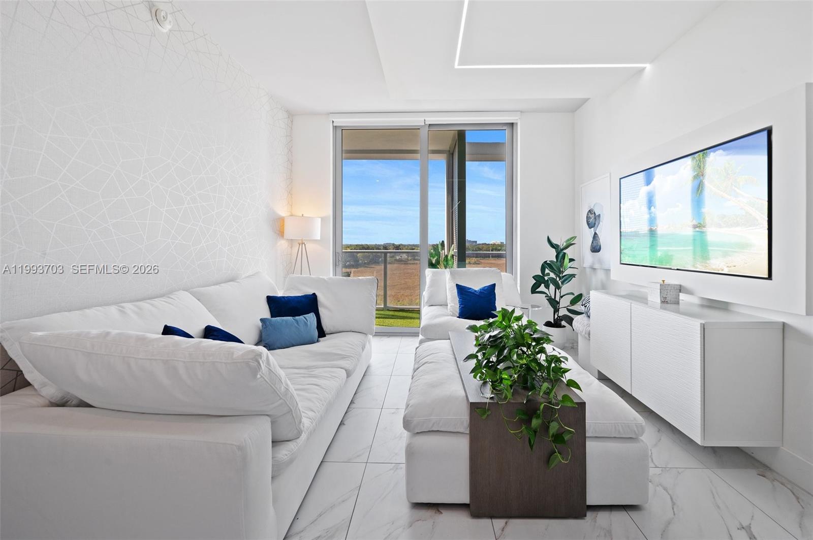 2000 Metropica Way, Unit 508 Sunrise, FL 33323 - Photo 6 of 25 a living room with furniture and a potted plant