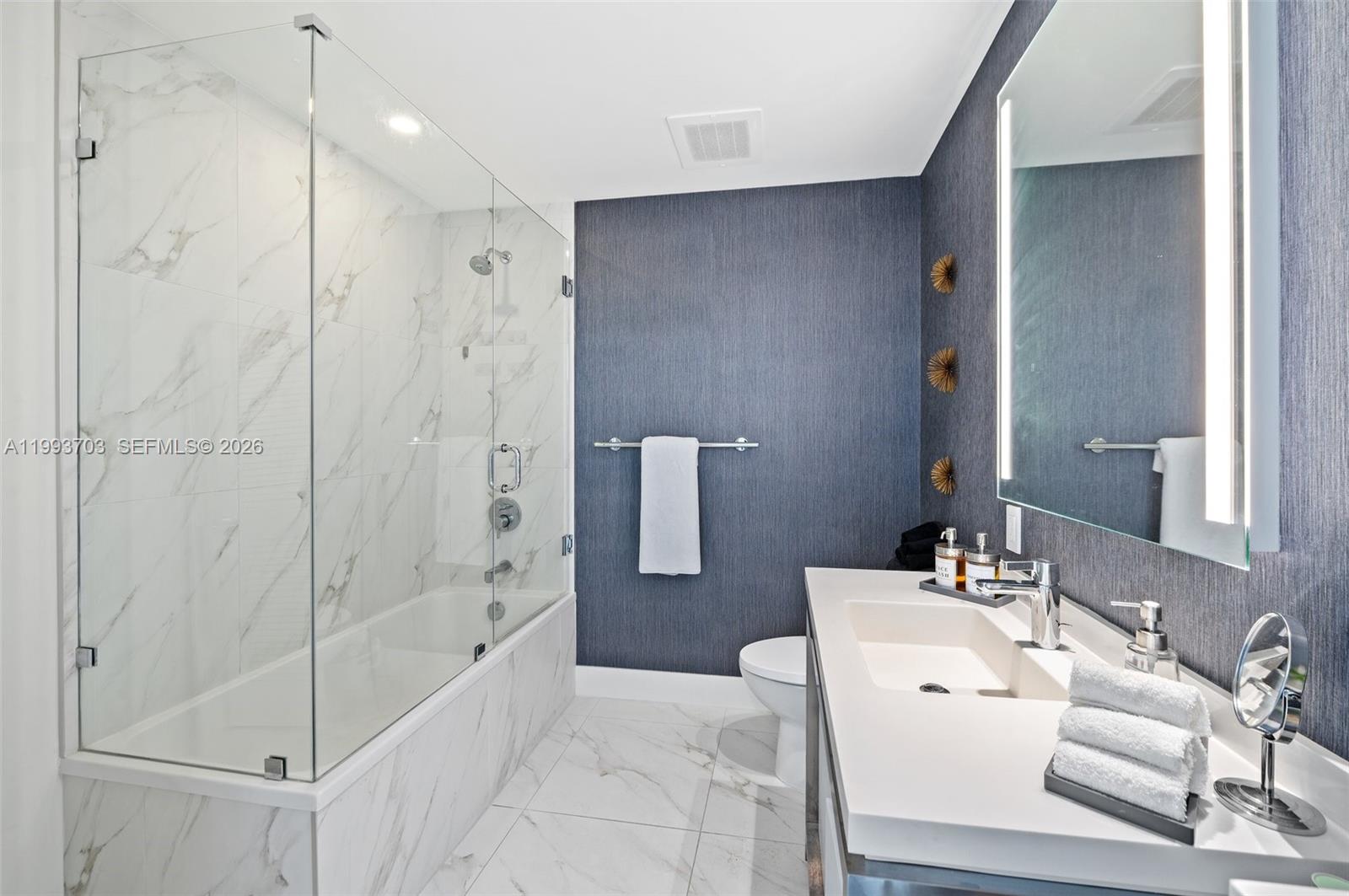 2000 Metropica Way, Unit 508 Sunrise, FL 33323 - Photo 10 of 25 a bathroom with a bathtub and a sink