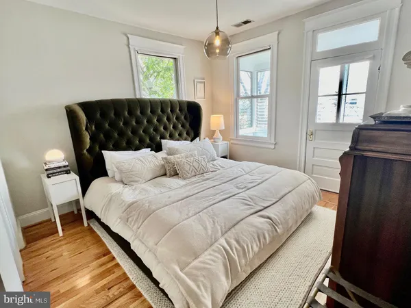 a bedroom with bed and window