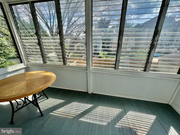a view of a room with a table and chair