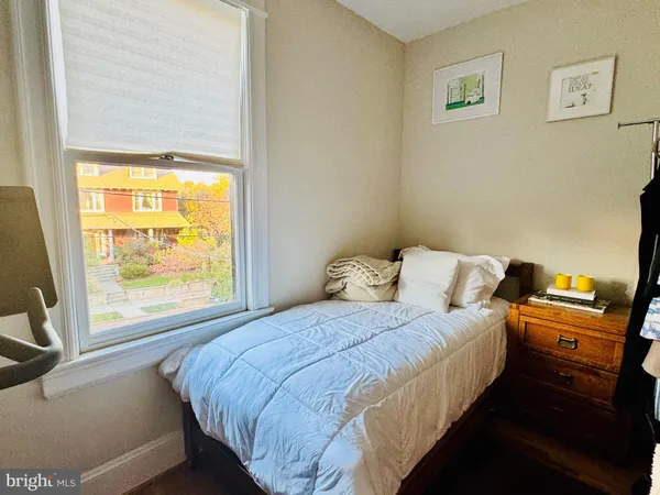 a view of a chair and table in backyard of the house