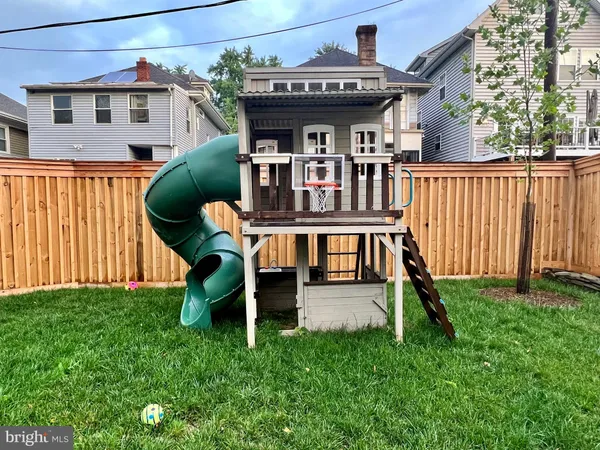 a view of a backyard with a fence
