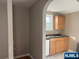 2-38 33rd Street Fair Lawn, NJ 07410 - Photo 4 of 22 a room with a sink and a window