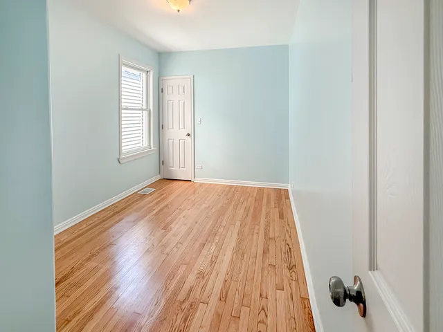 a view of a room with wooden floor and small space