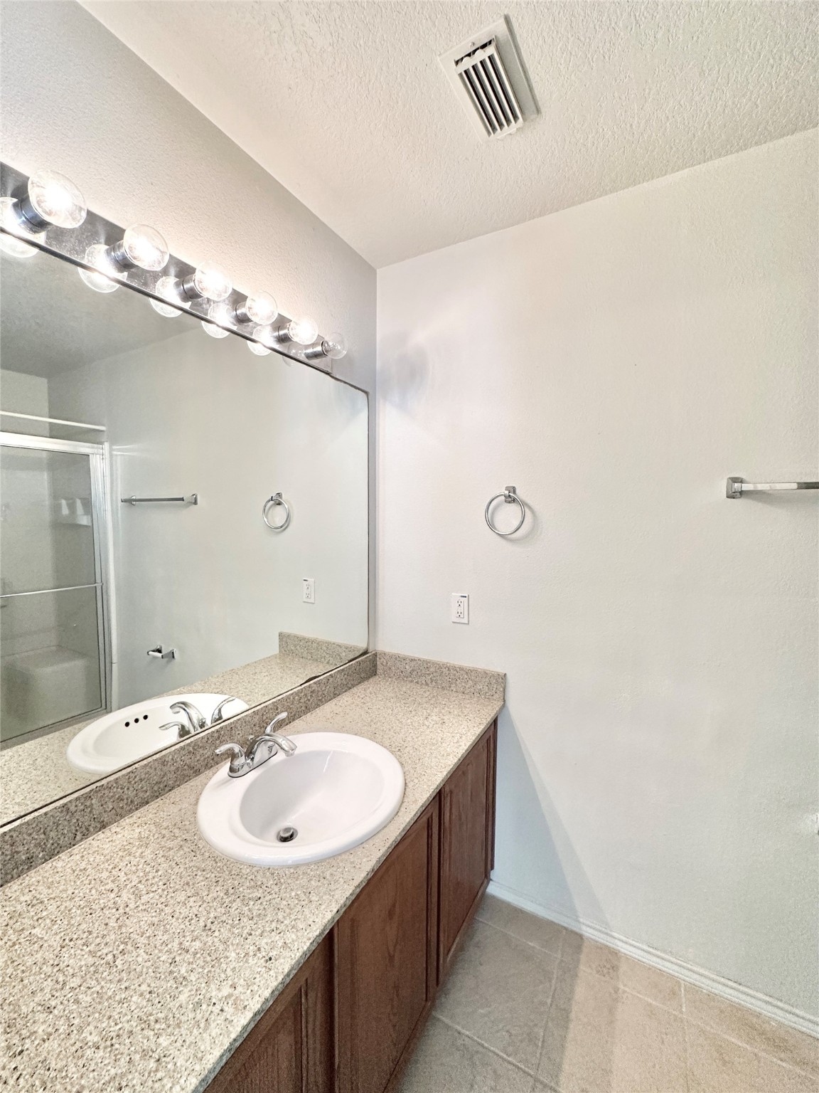 29709 Valley Center Drive Spring, TX 77386 - Photo 12 of 15 a bathroom with a sink and a mirror