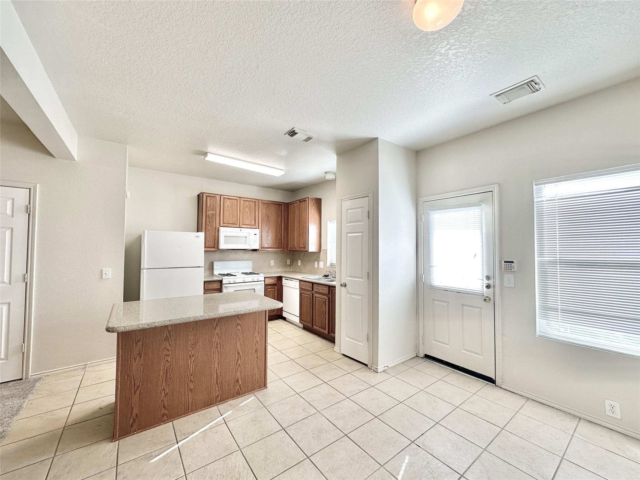 29709 Valley Center Drive Spring, TX 77386 - Photo 9 of 15 a large kitchen with cabinets and a counter top space