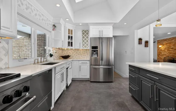 a kitchen with a refrigerator and a sink