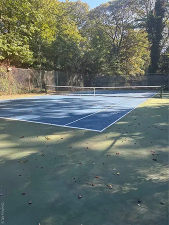 a view of swimming pool next to a yard