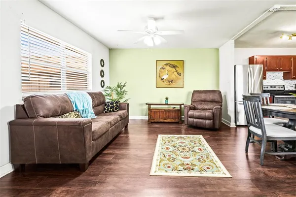 a living room with furniture and a rug