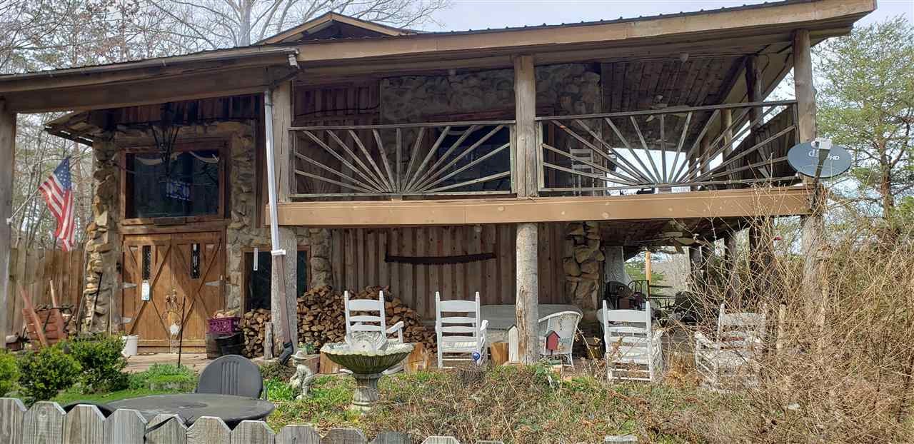 110 Forest Service Road Englewood, TN 37329 - Photo 6 of 33 a view of a chair and table in the patio
