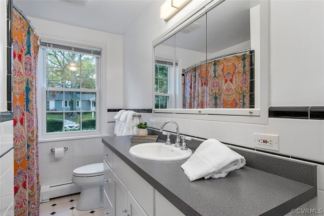 1 David Drive Henrico, VA 23229 - Photo 18 of 35 a bathroom with a sink toilet and a window