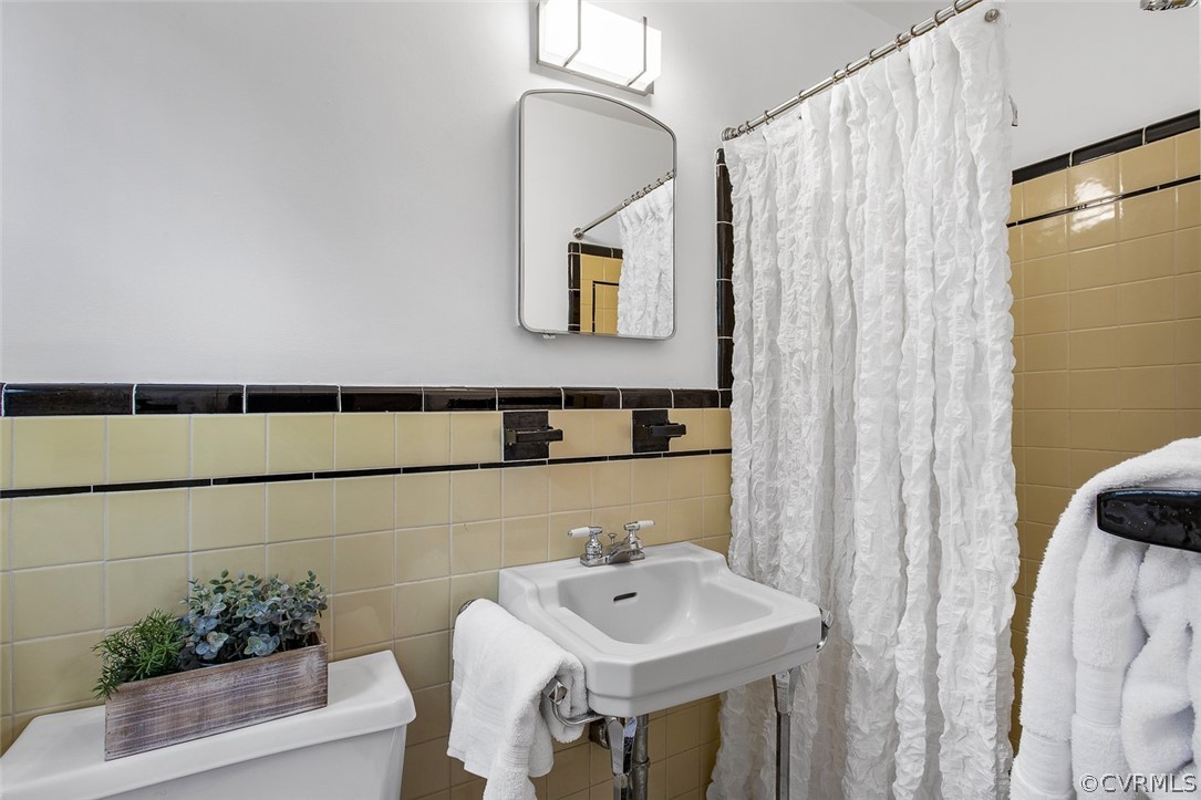 1 David Drive Henrico, VA 23229 - Photo 23 of 35 a bathroom with a sink and a mirror
