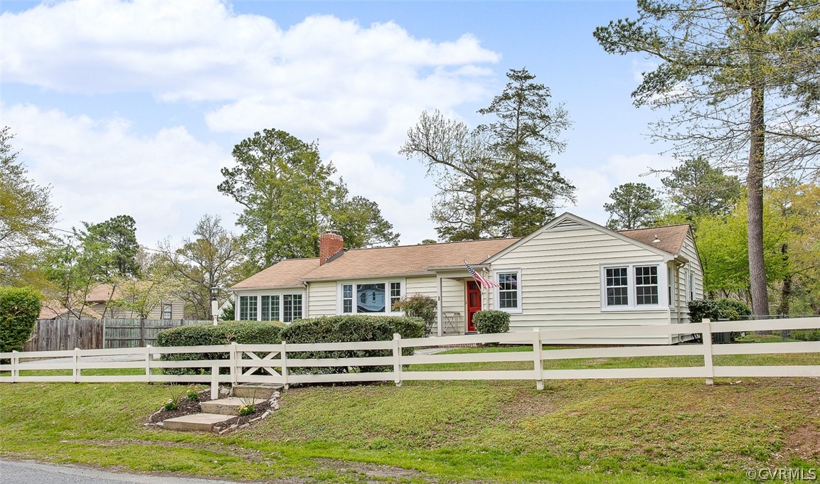 1 David Drive Henrico, VA 23229 - Photo 27 of 35 a front view of a house with a yard table and chairs