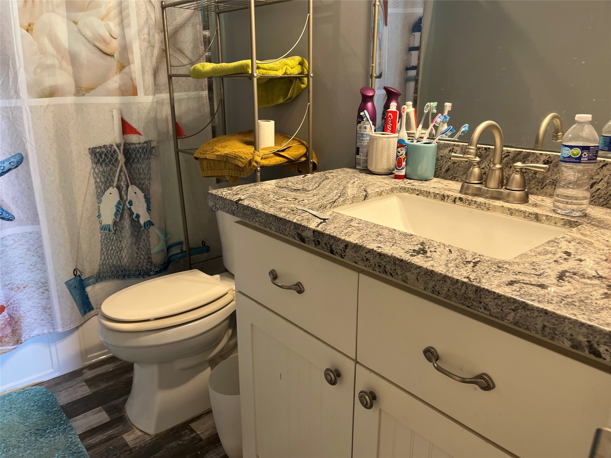 21511 Rio Villa Drive Houston, TX 77049 - Photo 45 of 45 a bathroom with a granite countertop toilet sink and mirror