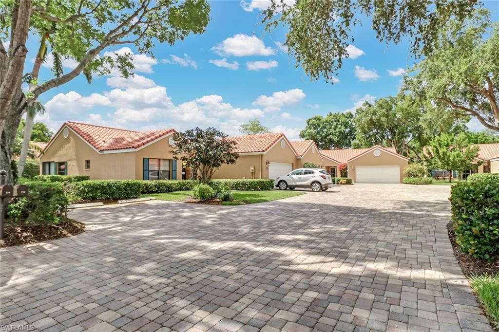 716 Reef Point Circle Naples, FL 34108 - Photo 3 of 15 a view of a house with a street