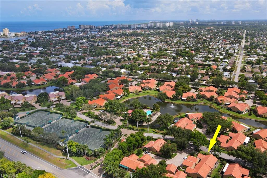 716 Reef Point Circle Naples, FL 34108 - Photo 4 of 15 an aerial view of a city