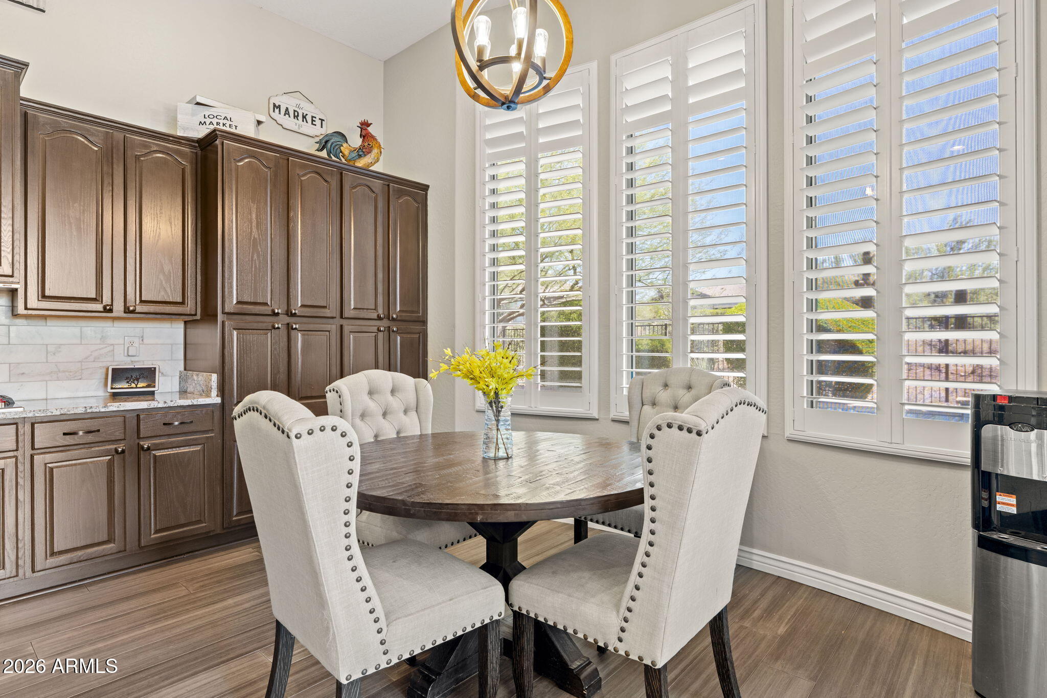 41619 North River Bend Road Anthem, AZ 85086 - Photo 16 of 84 a view of a dining room with furniture and a window