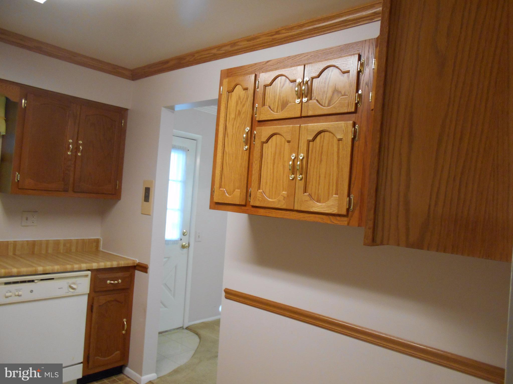 7070 Catalpa Road Frederick, MD 21703 - Photo 14 of 26 a hallway with washer and dryer