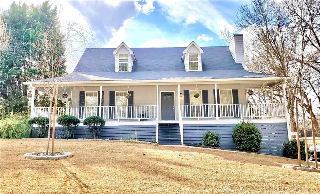 757 Cedarcrest Road Dallas, GA 30132 - Photo 1 of 1 a front view of a house with a yard and potted plants