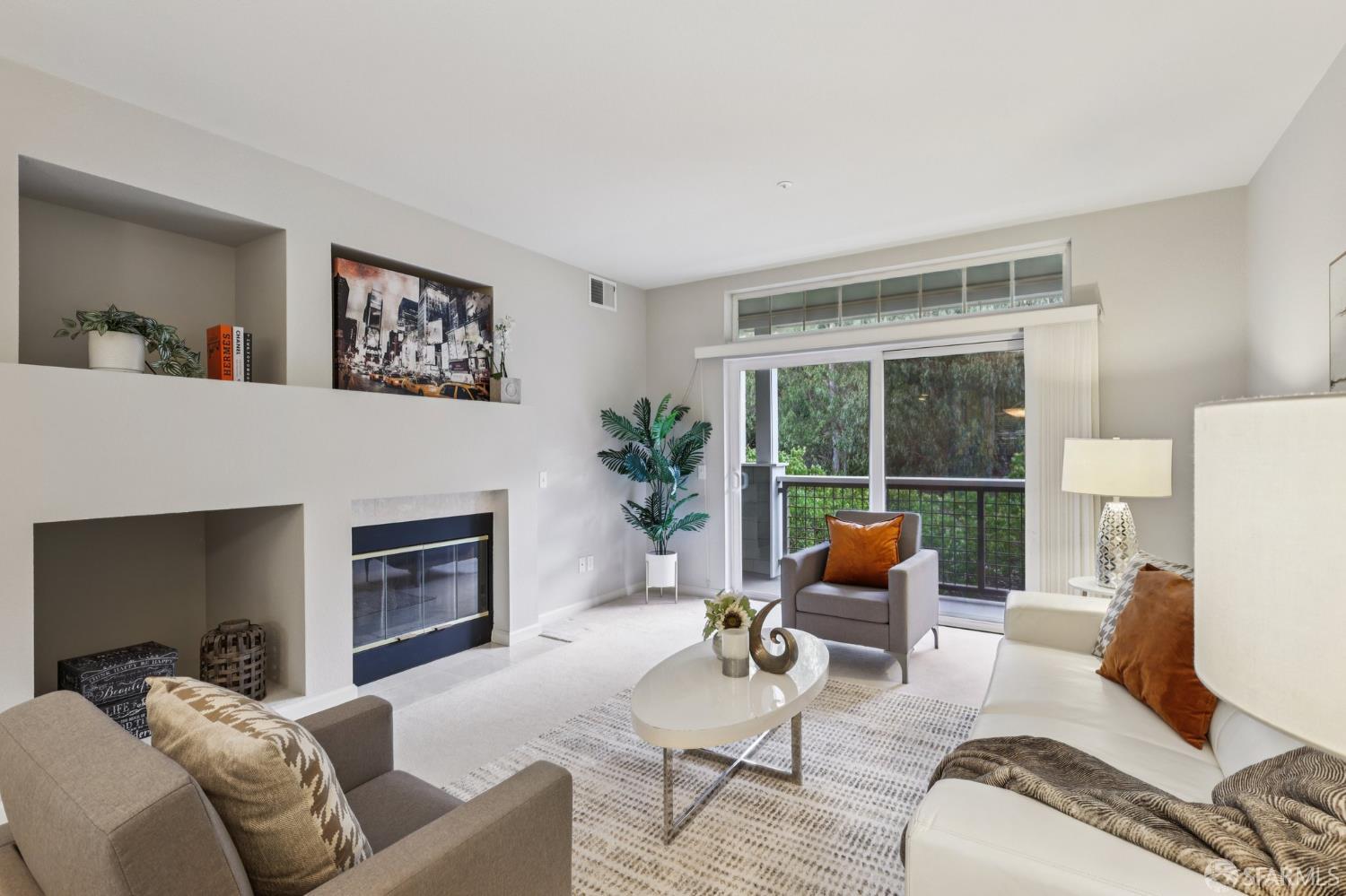 a living room with furniture or couch and a fireplace