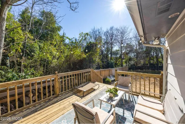 a view of a balcony with chairs