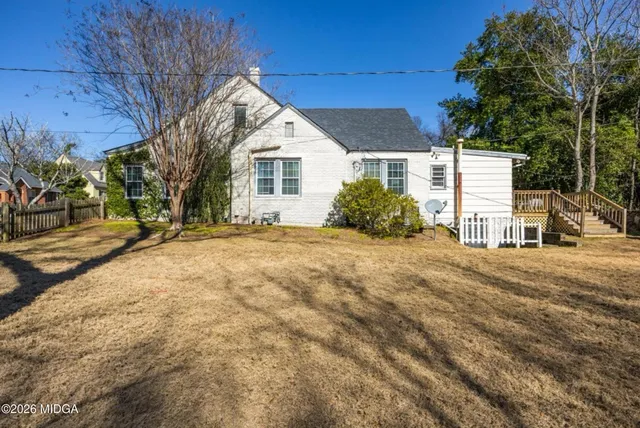 a view of backyard with green space