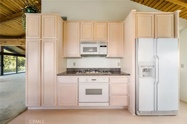 a bed room with furniture and a floor to ceiling window