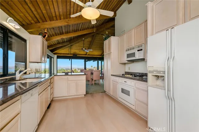 a white toilet sitting next to a bathroom sink