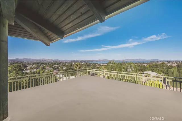 a view of a porch with chairs and table in the patio