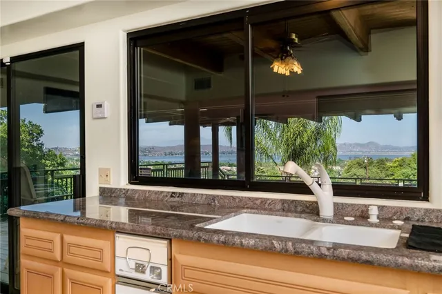 a view of a yard with plants and trees