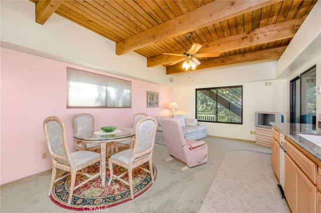 an aerial view of a house with a yard and potted plants