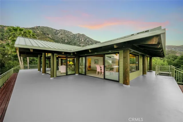 a kitchen with stainless steel appliances granite countertop a sink a stove and cabinets