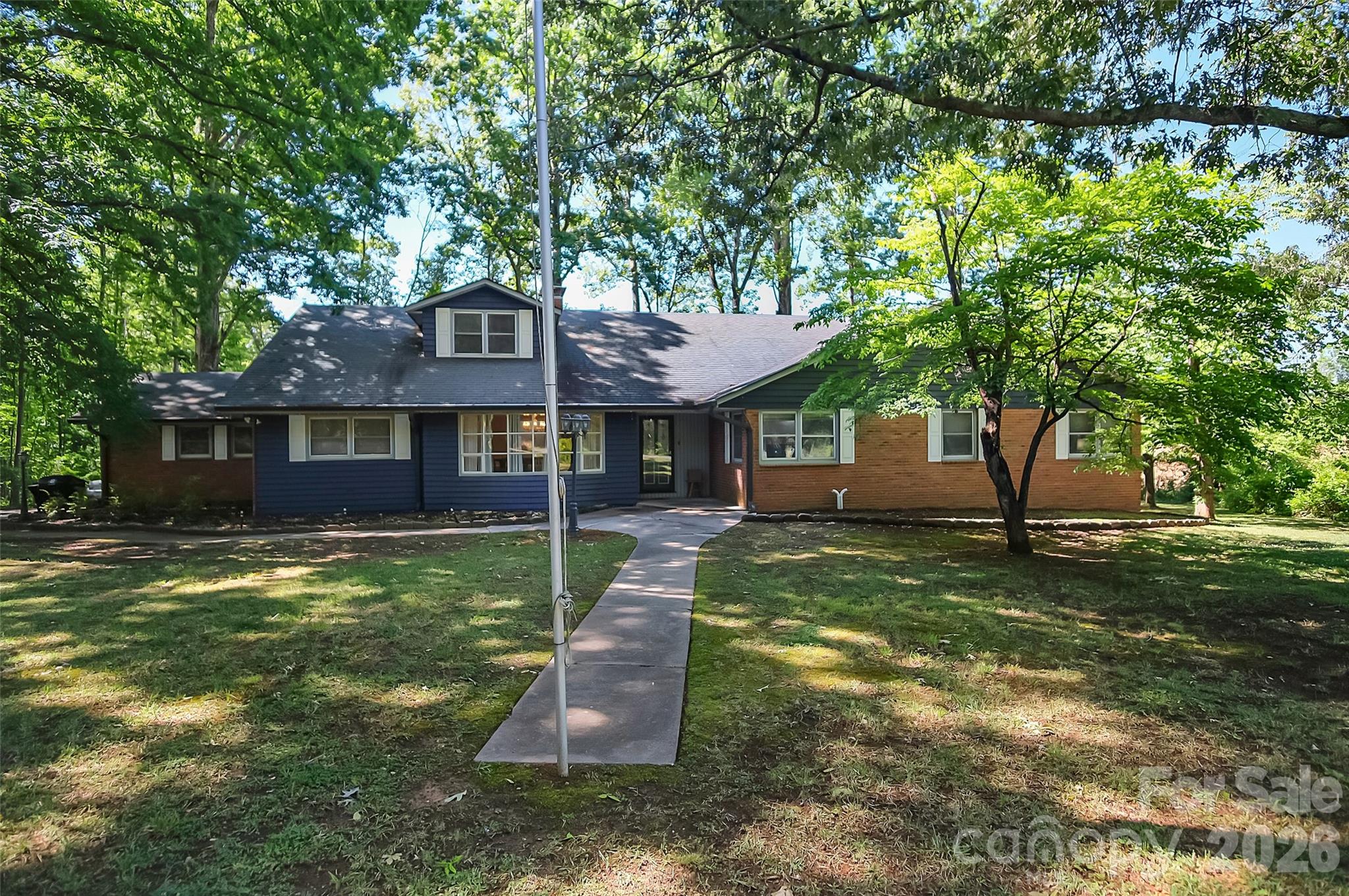 808 Old Mt Holly Road Stanley, NC 28164 - Photo 46 of 48 a front view of a house with a yard