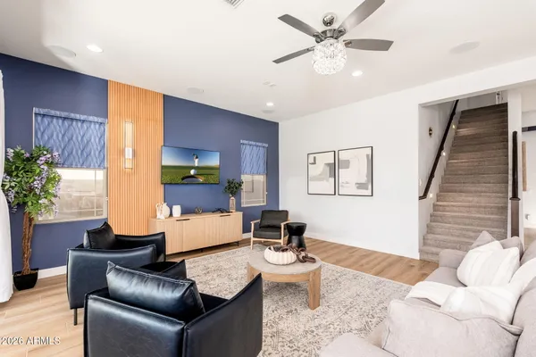 a kitchen with stainless steel appliances kitchen island granite countertop a kitchen island hardwood floor sink and stove