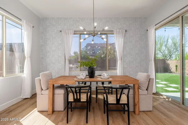 a bathroom with a sink toilet a mirror and shower