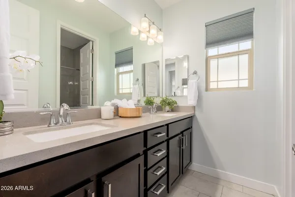 a bedroom with a bed table and window