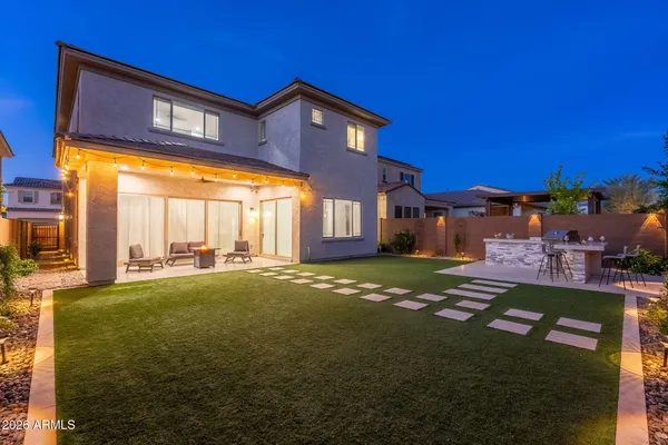 a view of a kitchen with kitchen island a large window a sink and living room view