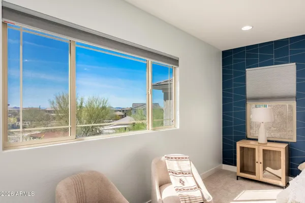 a front view of a house with a garden and porch