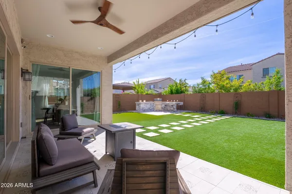 a view of swimming pool with outdoor seating and city view