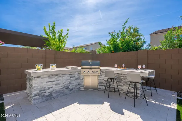 a view of living room with furniture and a fireplace