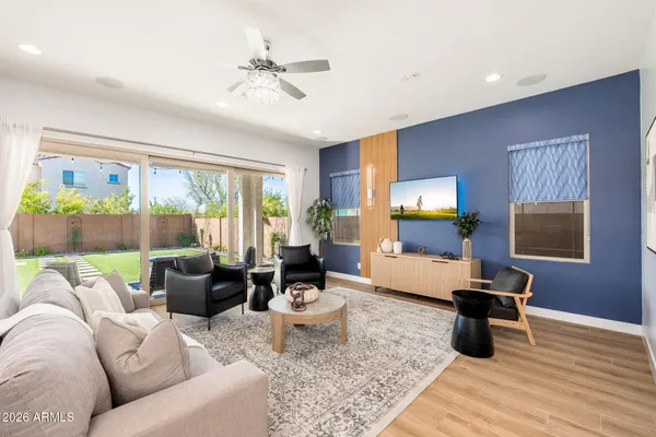 a living room with furniture and a large window
