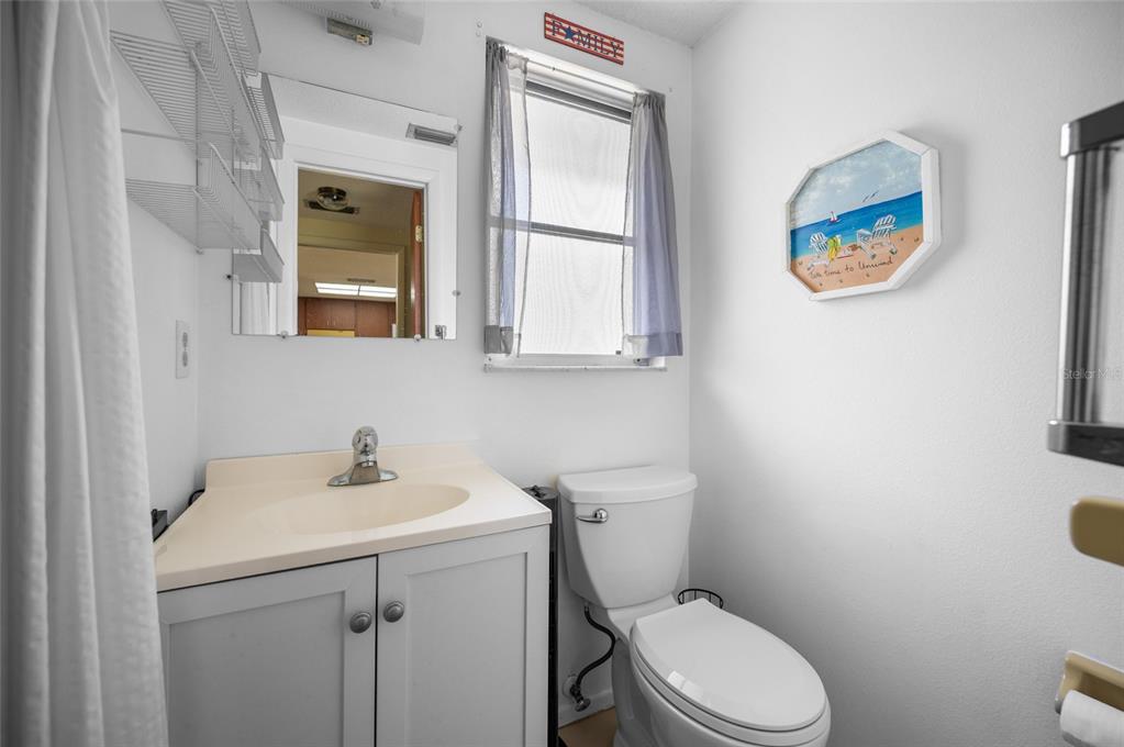 901 Ponderosa Road Venice, FL 34293 - Photo 23 of 33 a white toilet sitting next to a bathroom sink