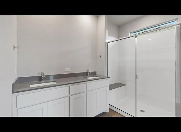 a bathroom with a sink and mirror