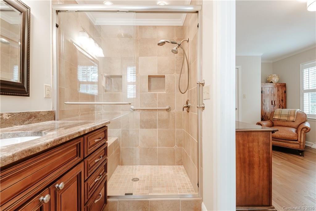 1001 Lansdowne Road Charlotte, NC 28270 - Photo 24 of 37 a bathroom with a granite countertop sink mirror and