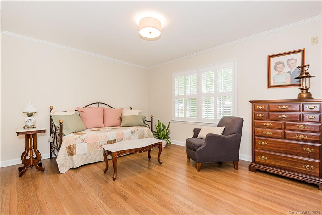 1001 Lansdowne Road Charlotte, NC 28270 - Photo 27 of 37 a living room with furniture and a wooden floor