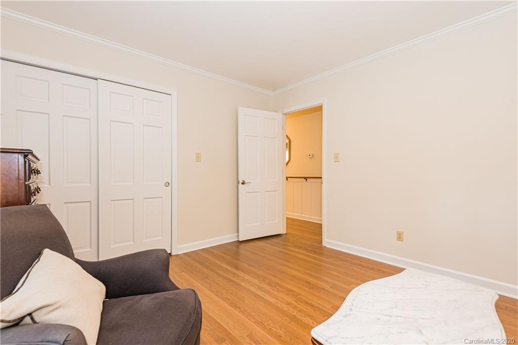 1001 Lansdowne Road Charlotte, NC 28270 - Photo 28 of 37 a bedroom with a bed and a couch