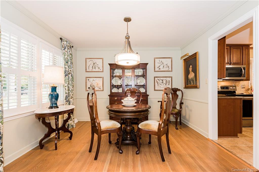 1001 Lansdowne Road Charlotte, NC 28270 - Photo 10 of 37 a view of a dining room with furniture window and wooden floor