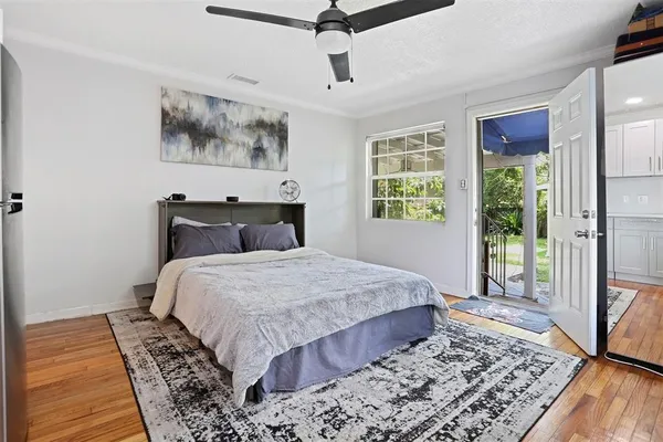 a bedroom with a large bed and a window