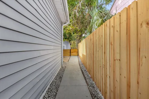 a view of a pathway with a garden